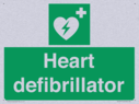 green-background-with-white-text-and-heart-defibrillator-symbol--white-cross-and~
